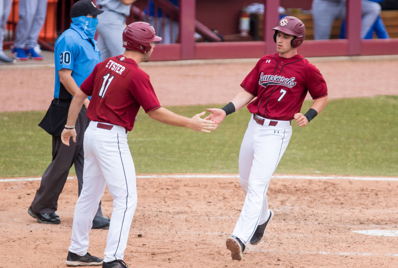 South Carolina Gamecocks third baseman Brennan Milone (7) scores against the Florida Gators.
