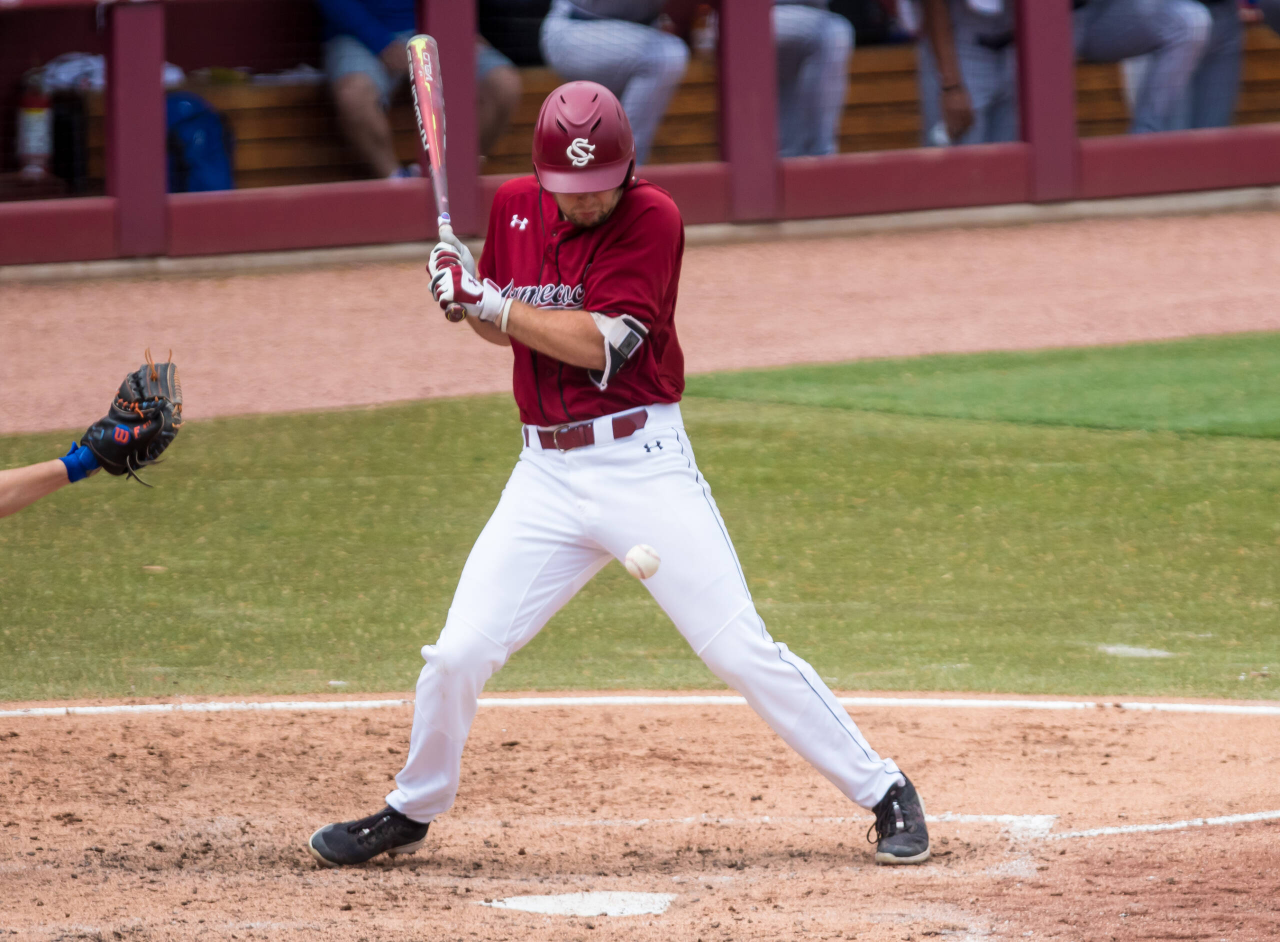 South Carolina Gamecocks outfielder Andrew Eyster (11) is hit by a pitch against the Florida Gators.