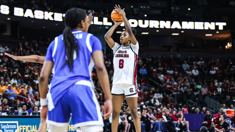 Joyce Edwards takes a jump shot in the lane with a Kentucky defender in the foregrund.