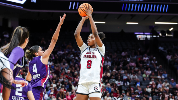 Joyce Edwards pulls up for a midrange jump shot as a TCU defender stretches toward her.