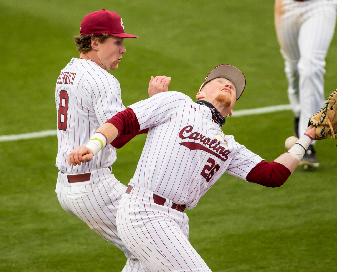 South Carolina Gamecocks infielder Jeff Heinrich (8) and South Carolina Gamecocks David Mendham (26) collide while attempting to catch a foul ball. The ball dropped safely.

South Carolina vs. Dayton Baseball, Feb. 19, 2021, Founders Park, Columbia, SC.

Photo by Jeff Blake