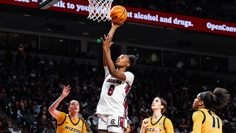 Joyce Edwards rises for a short jump shot in the lane over three Missouri defenders.