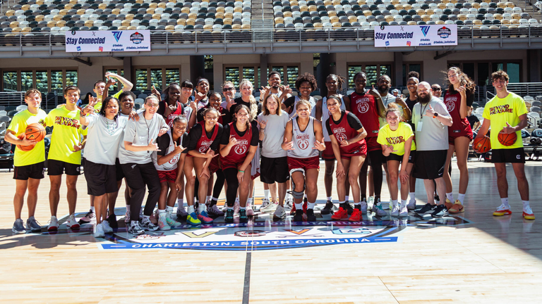 South Carolina women's basketball players, coaches and managers pose for a group photo after practice at TheLinkU Invitational.