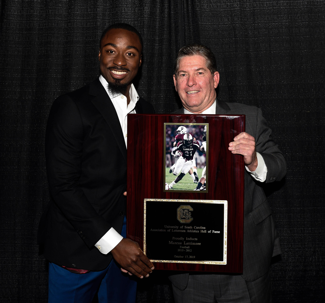 Marcus Lattimore (Football, 2010-12) with Athletics Director Ray Tanner | 2019 South Carolina Athletics HOF Induction Ceremony | Thursday, Oct. 17, 2019 | Colonial Life Arena | Columbia, S.C.