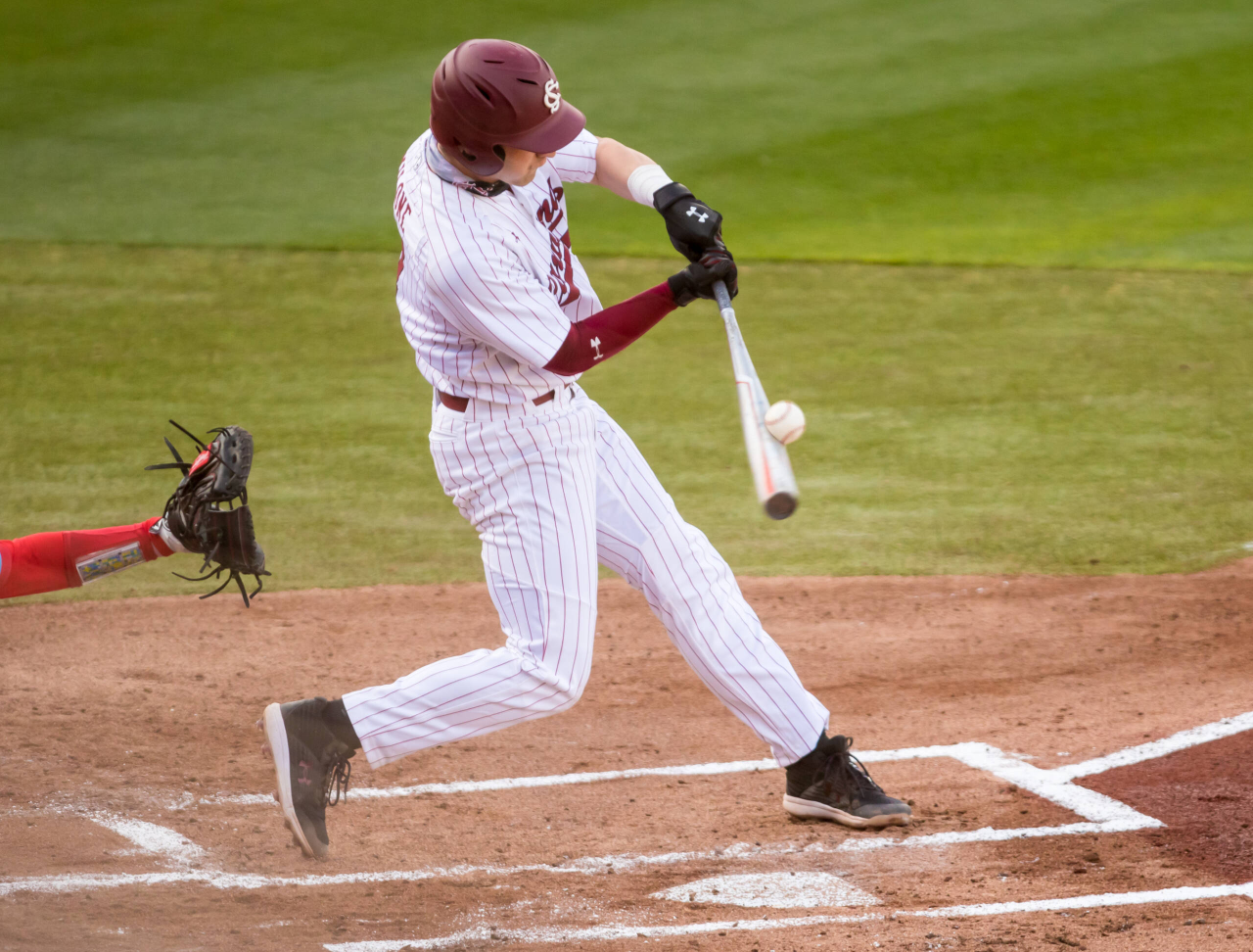 South Carolina Gamecocks infielder Brennan Milone (7) gets a base hit during the first inning.

South Carolina vs. Dayton Baseball, Feb. 19, 2021, Founders Park, Columbia, SC.

Photo by Jeff Blake