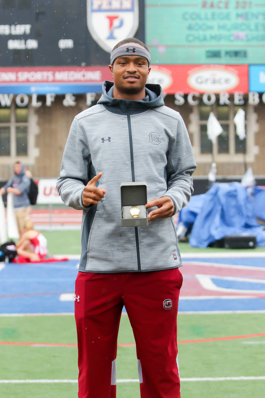 Quincy Hall celebrates his 400mH championship at the 125th Penn Relays | Photo by Charles Revelle | April 26, 2019