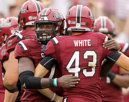 South Carolina kicker Parker White is hugged by Malik Young after kicking the game-winning field goal against Missouri during fourth-quarter action in Columbia, S.C. on Saturday, Oct. 6, 2018. (Travis Bell/SIDELINE CAROLINA)