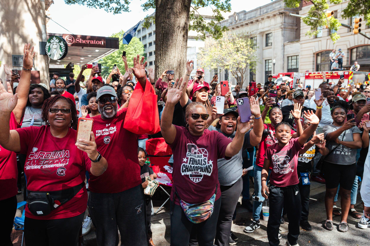 Fans wave at the Gamecocks riding past in the National Championship parade.