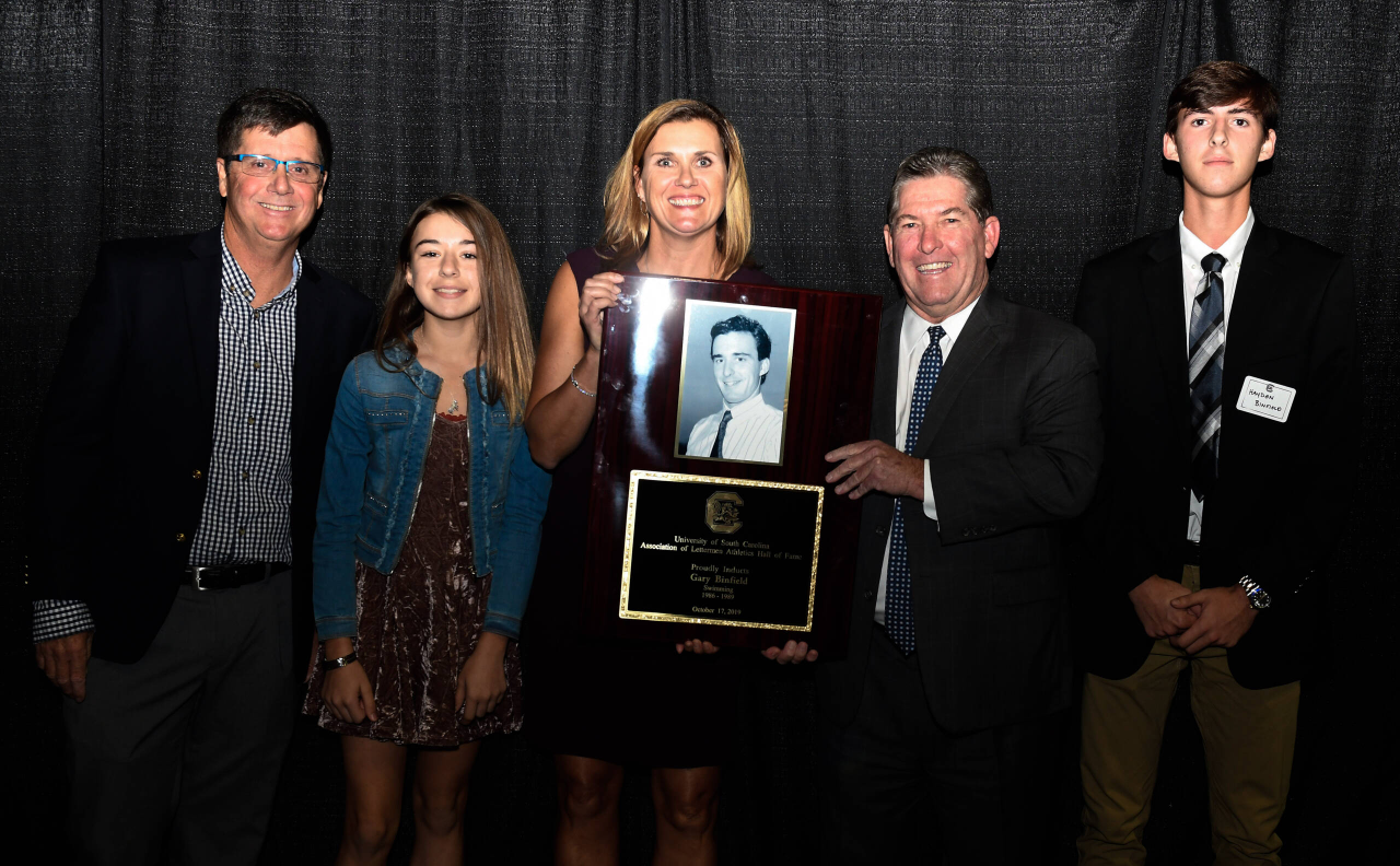 Family of the late Gary Binfield (Swimming, 1986-89) with Athletics Director Ray Tanner | 2019 South Carolina Athletics HOF Induction Ceremony | Thursday, Oct. 17, 2019 | Colonial Life Arena | Columbia, S.C.