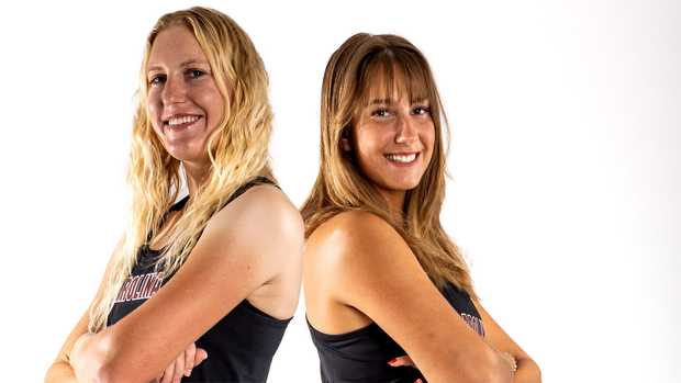 Laura Friedman and Anna Kantor stand back to back.