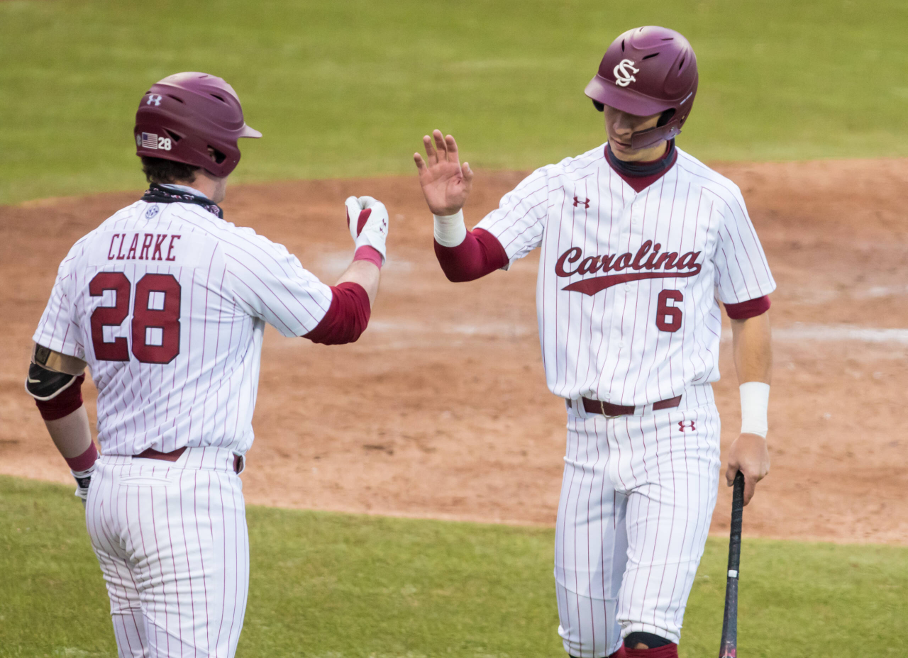 South Carolina Gamecocks infielder George Callil (6) is congratulated by South Carolina Gamecocks Wes Clarke (28) after scoring.

South Carolina vs. Dayton Baseball, Feb. 19, 2021, Founders Park, Columbia, SC.

Photo by Jeff Blake
