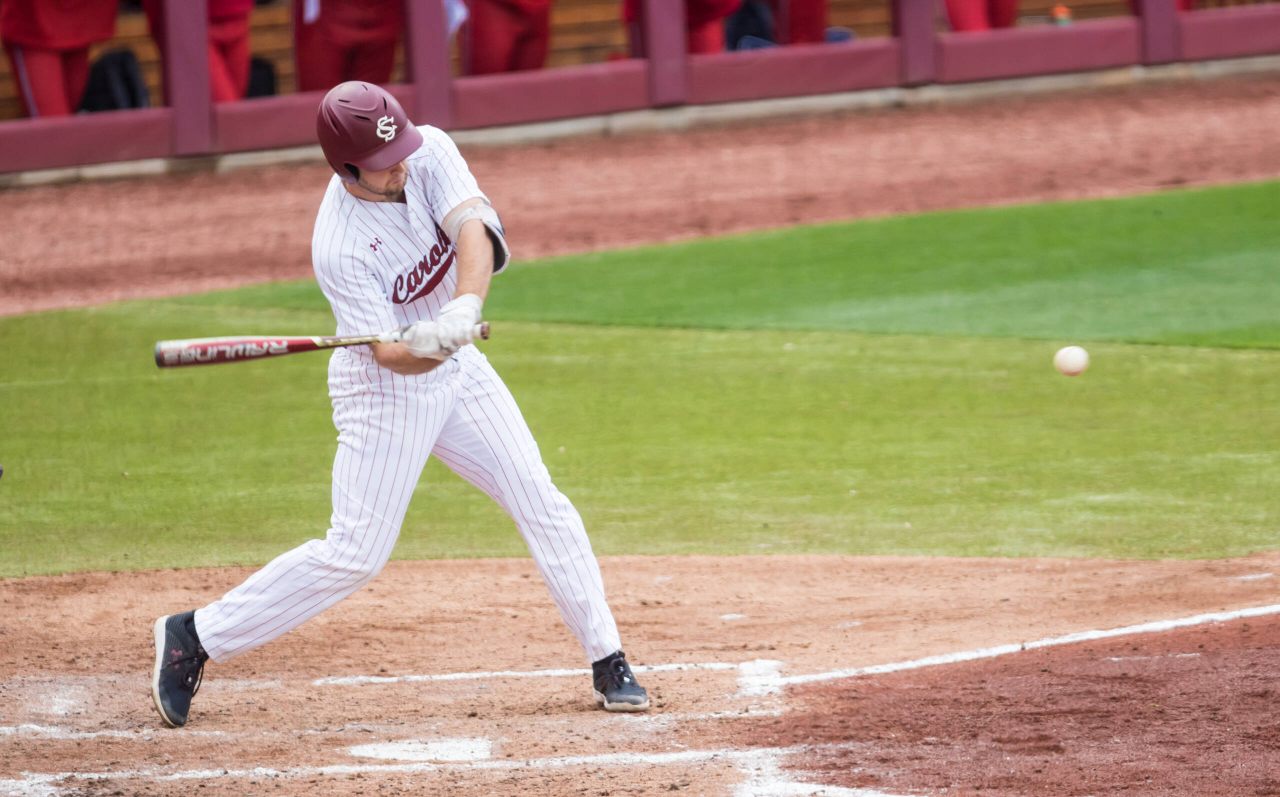 South Carolina Gamecocks outfielder Andrew Eyster (11) hits a grand slam during the fourth inning.

South Carolina vs. Dayton Baseball, Feb. 19, 2021, Founders Park, Columbia, SC.

Photo by Jeff Blake