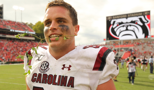 South Carolina tight end Kyle Markway (84) leaves Sanford Stadium with a piece of the hedges in his mouth after a overtime win in Athens, Ga. on Saturday, Oct. 12, 2019. (Travis Bell/SIDELINE CAROLINA)