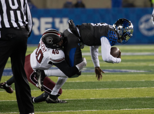 Kentucky Wildcats quarterback Terry Wilson (3) brought down by South Carolina's Noah Vincent, 40,  as Kentucky played South Carolina  on December 5, 2020.  Photo by Mark Cornelison 