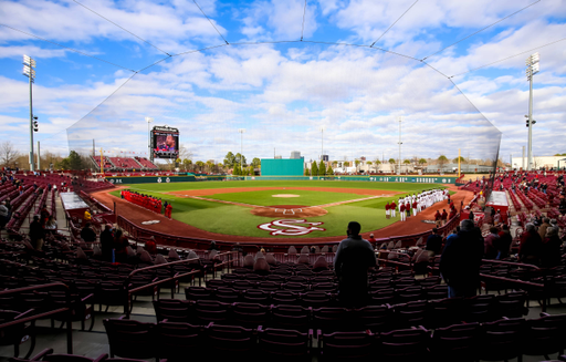 South Carolina Gamecocks and Dayton Flyers players stand for the National Anthem before the season-opening game.South Carolina vs. Dayton Baseball, Feb. 19, 2021, Founders Park, Columbia, SC.Photo by Jeff Blake