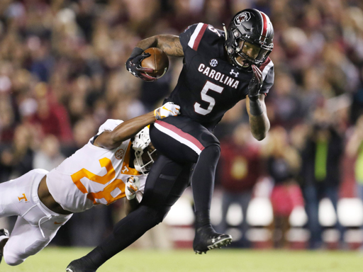 South Carolina's Rico Dowdle breaks away from Tennessee's Baylen Buchanan during first-quarter action in Columbia, S.C. on Saturday, Oct. 27, 2018. (Travis Bell/SIDELINE CAROLINA)