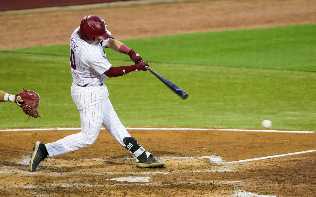 South Carolina Gamecocks catcher Colin Burgess (10) hits an RBI double during the fourth inning against the Arkansas Razorbacks.