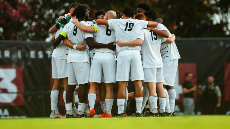 Men's soccer team huddle