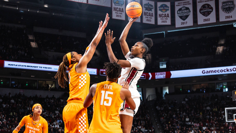 Joyce Edwards rises above two Tennessee defenders for a jump shot in the lane.