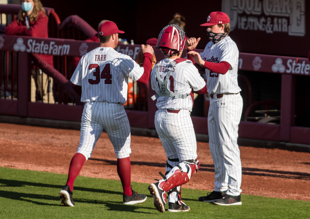 South Carolina Gamecocks Thomas Farr (34) receives congratulations from his teammates after a perfect first inning.

South Carolina vs. Dayton Baseball, Feb. 19, 2021, Founders Park, Columbia, SC.

Photo by Jeff Blake