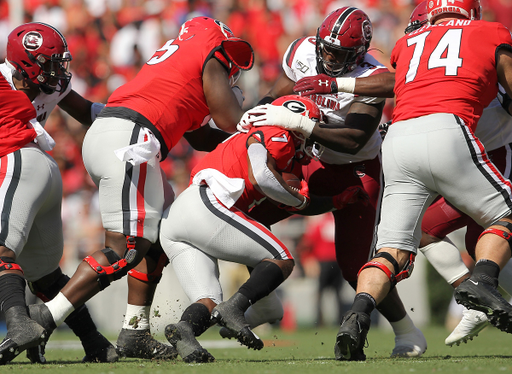 South Carolina defensive lineman Javon Kinlaw (3) wraps up Georgia running back D'Andre Swift (7) during first-quarter action in Athens, Ga. on Saturdaat, Oct. 12, 2019. (Travis Bell/SIDELINE CAROLINA)