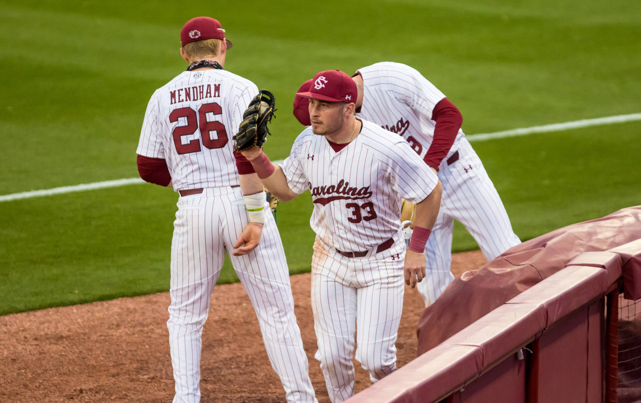 South Carolina Gamecocks outfielder Brady Allen (33) celebrates catching a pop fly while crashing into the railing.

South Carolina vs. Dayton Baseball, Feb. 19, 2021, Founders Park, Columbia, SC.

Photo by Jeff Blake