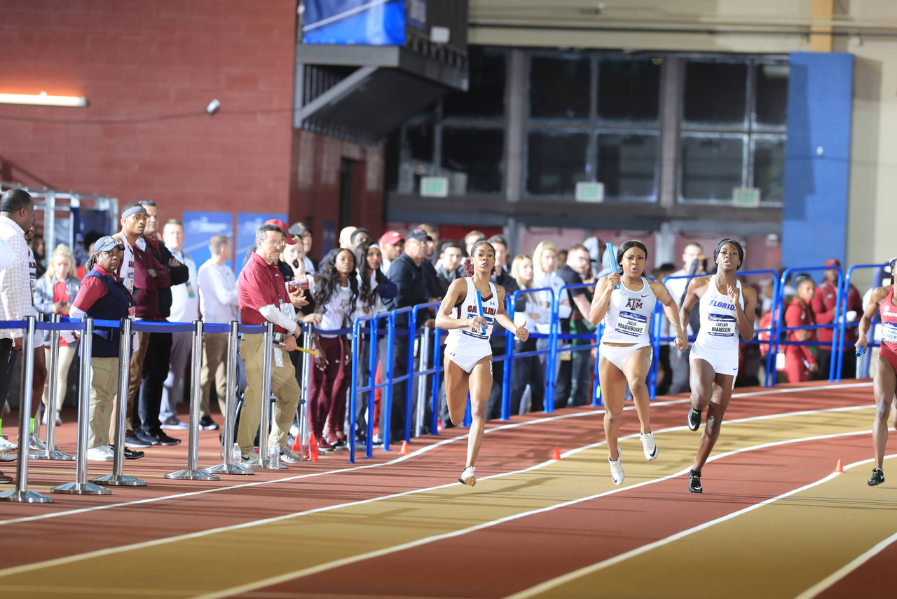 Stephanie Davis carries the stick as part of Carolina's 4x400m relay national championship | March 9, 2019 | Photo by Walt Middleton