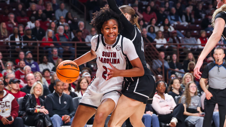 Ayla McDowell drives past a defender toward the lane.