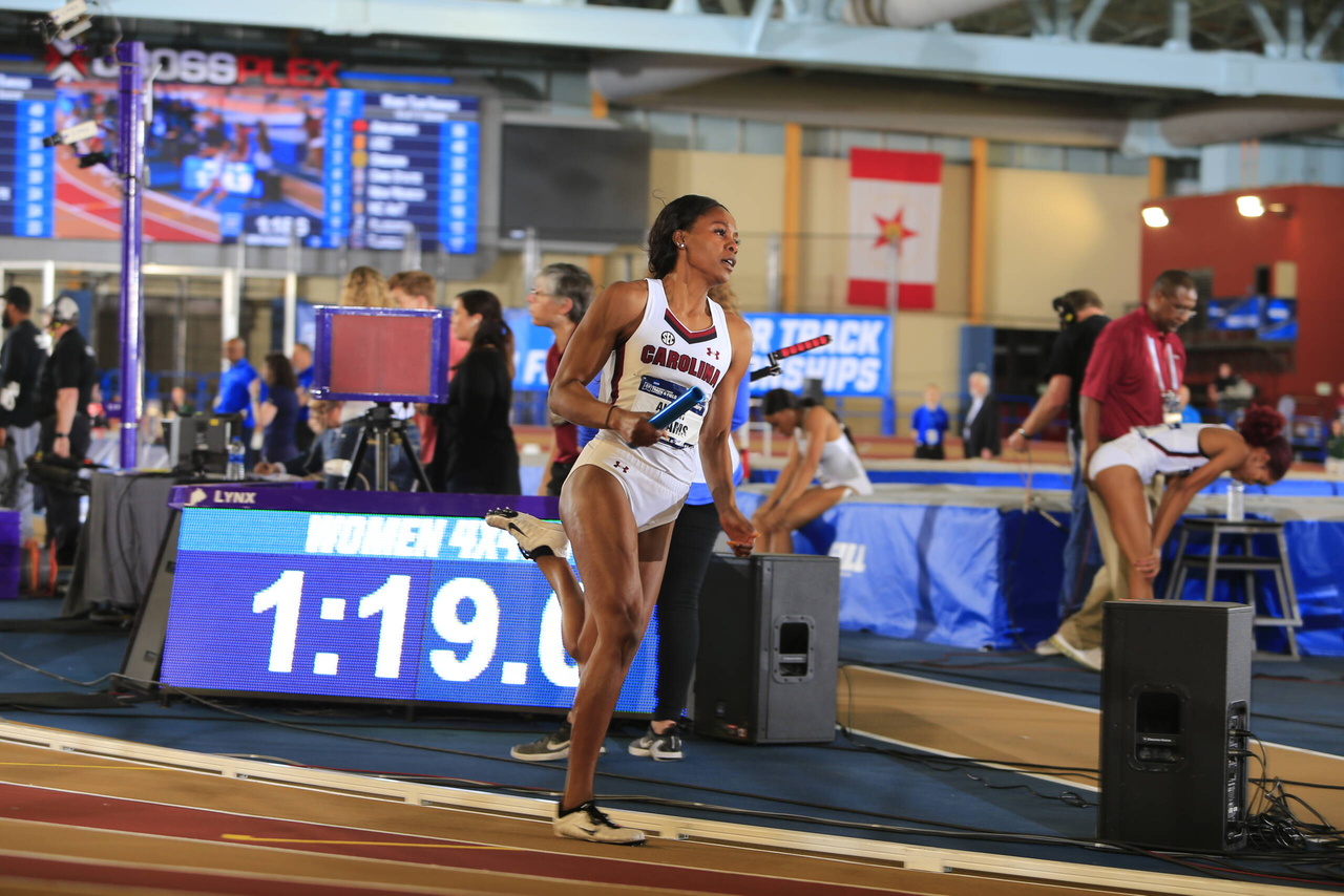 Aliyah Abrams carries the stick as part of Carolina's 4x400m relay national championship | March 9, 2019 | Photo by Walt Middleton