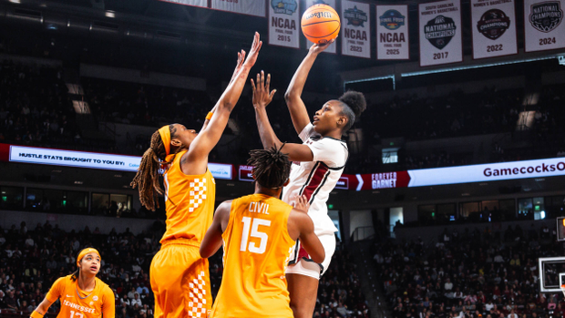 Joyce Edwards rises above two Tennessee defenders for a jump shot in the lane.