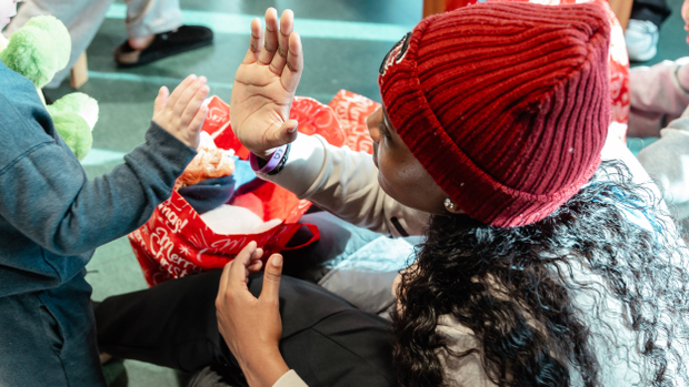 Sania Feagin high fives a child during the team's visit to Prisma Children's Hospital.