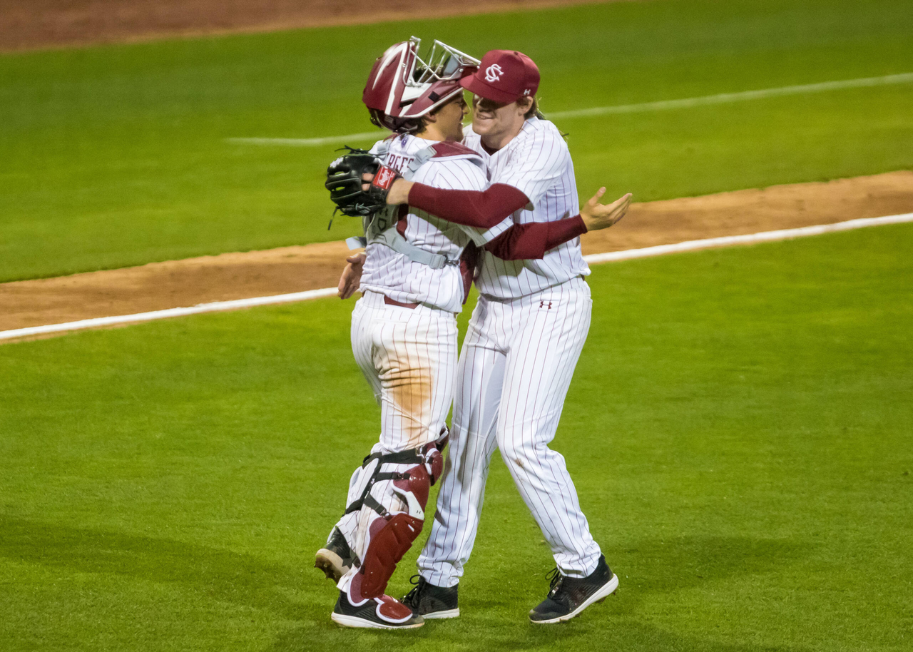 South Carolina Gamecocks Jack Mahoney (23) and South Carolina Gamecocks catcher Colin Burgess (10) celebrate after defeating the Dayton Flyers.

South Carolina vs. Dayton Baseball, Feb. 19, 2021, Founders Park, Columbia, SC.

Photo by Jeff Blake
