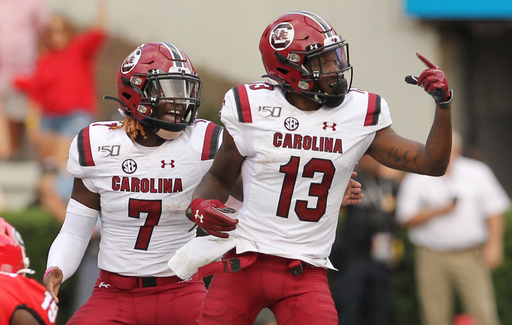 South Carolina quarterback Dakereon Joyner (7) and wide receiver Shi Smith (13) tell several players to change their positions before a snap against Georgia during fourth-quarter action in Athens, Ga. on Saturday, Oct. 12, 2019. (Travis Bell/SIDELINE CAROLINA)