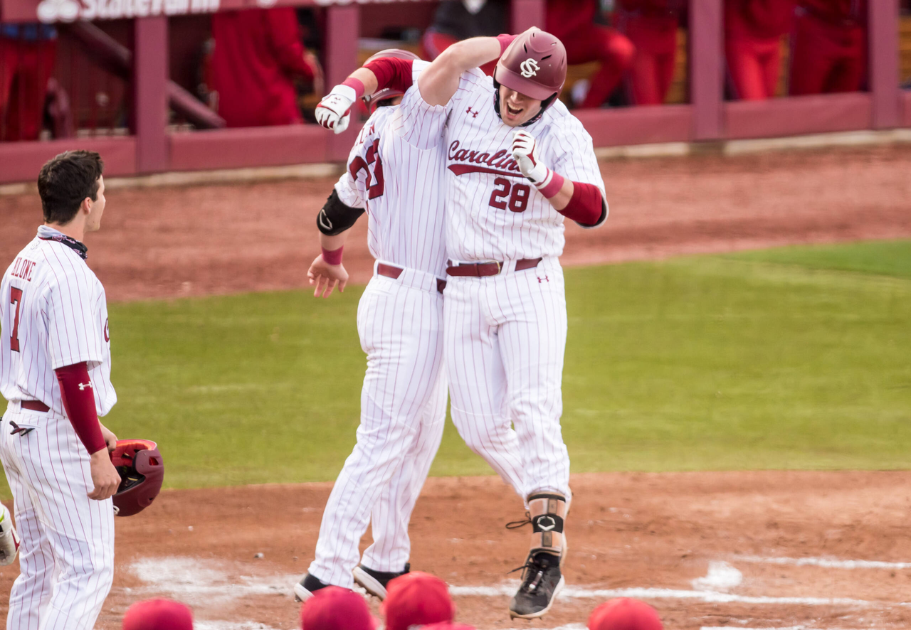 South Carolina Gamecocks Wes Clarke (28) and South Carolina Gamecocks outfielder Brady Allen (33) celebrate Clarkeâ??s 3-run-homer during the first inning.

South Carolina vs. Dayton Baseball, Feb. 19, 2021, Founders Park, Columbia, SC.

Photo by Jeff Blake
