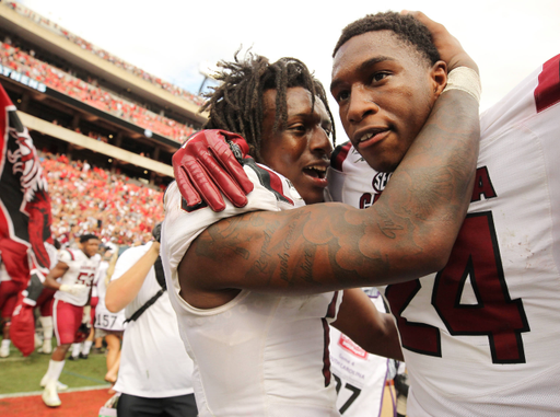 South Carolina defensive back Jaycee Horn (1) and defensive back Israel Mukuamu (24) celebrate their overtime win against Georgia in Athens, Ga. on Saturday, Oct. 12, 2019. (Travis Bell/SIDELINE CAROLINA)