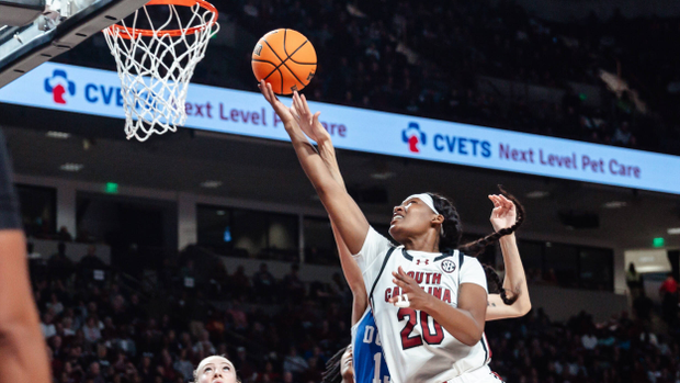 Sania Feagin stretches out for a layup against a Duke defender, 12/5/24