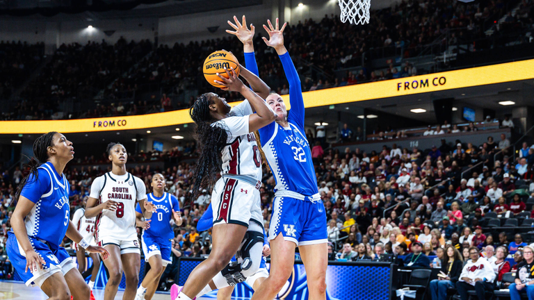 Ta'Niya Latson goes up for a contested layup against a Kentucky defender.