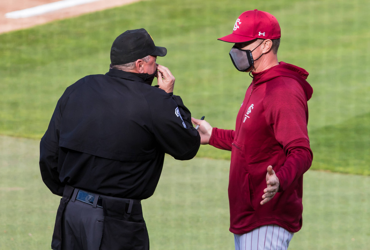 South Carolina Gamecocks head coach Mark Kingston speaks with an umpire before the game against the Dayton Flyers.

South Carolina vs. Dayton Baseball, Feb. 19, 2021, Founders Park, Columbia, SC.

Photo by Jeff Blake