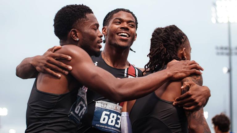 Jasauna Dennis, Andrew Salvodon and Devan Crumpton celebrating after winning the 4x400 meter relay at the East Coast Relays.