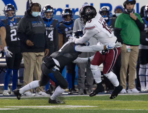 South Carolina Gamecocks wide receiver Shi Smith (13) stiff armed past Kentucky Wildcats safety Vito Tisdale (7)  as Kentucky played South Carolina  on December 5, 2020.  Photo by Mark Cornelison 