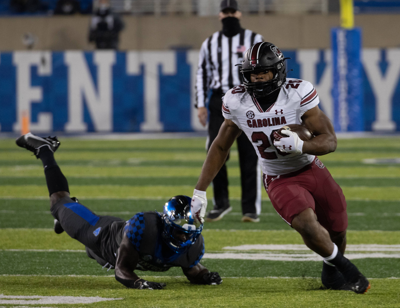 South Carolina Gamecocks running back Kevin Harris (20) pushed away Kentucky Wildcats defensive back Tyrell Ajian (23)  as Kentucky played South Carolina  on December 5, 2020.  Photo by Mark Cornelison 
