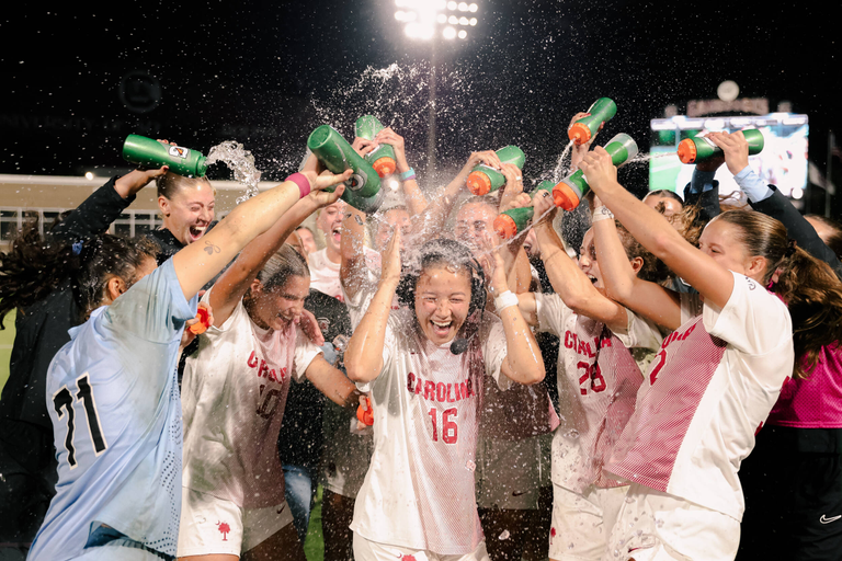 women's soccer celebrates win over kentucky with water bottle sprays