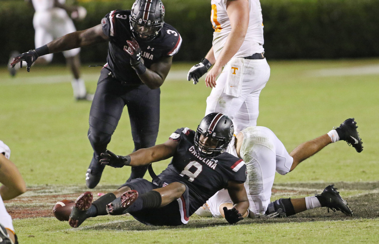 South Carolina's Javon Kinlaw (3) hurries to pick up the ball after D.J. Wonnum (8) caused Tennessee's Jarrett Guarantano to fumble during fourth-quarter action in Columbia, S.C. on Saturday, Oct. 27, 2018. (Travis Bell/SIDELINE CAROLINA)