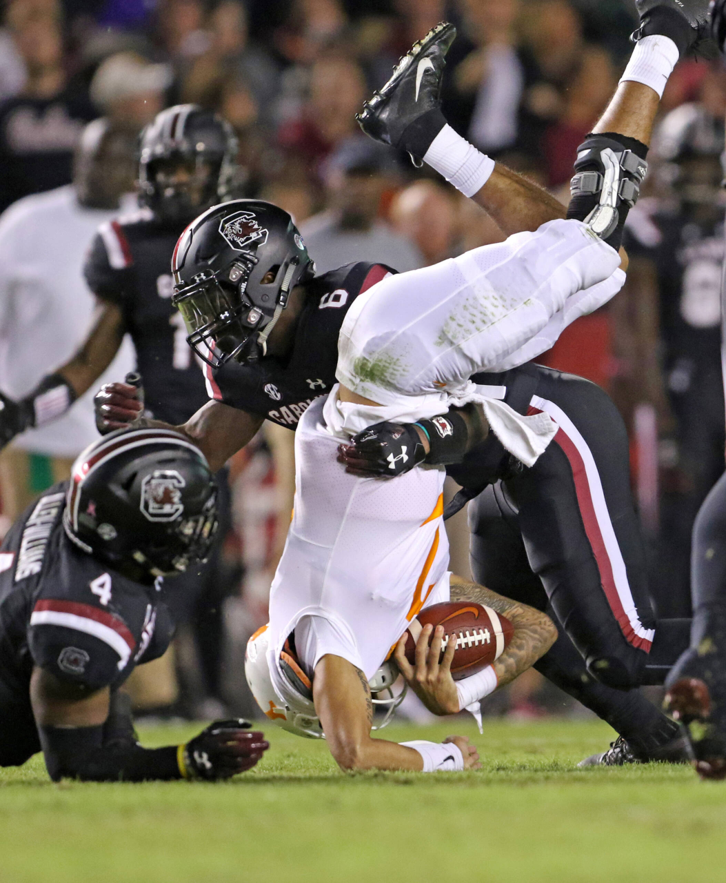 Tennessee quarterback Jarrett Guarantano is upended by South Carolina's T.J. Brunson (6) during second-quarter action in Columbia, S.C. on Saturday, Oct. 27, 2018. (Travis Bell/SIDELINE CAROLINA)