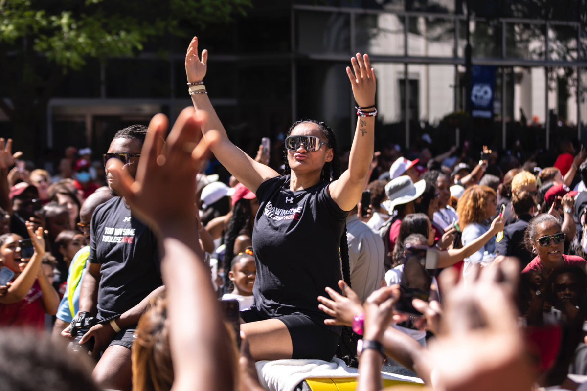 Te-Hina Paopao plays to the crowd riding in the National Championship parade.