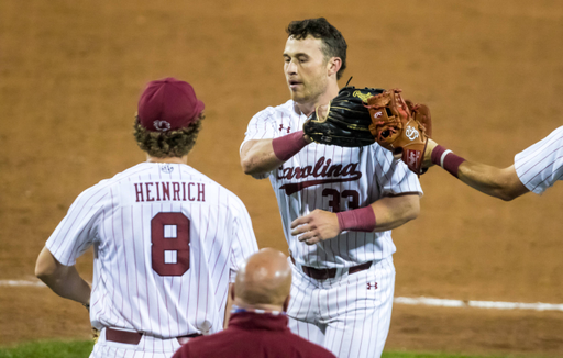 South Carolina Gamecocks outfielder Brady Allen (33) is congratulated after an outstanding catch in the outfield against the Florida Gators.