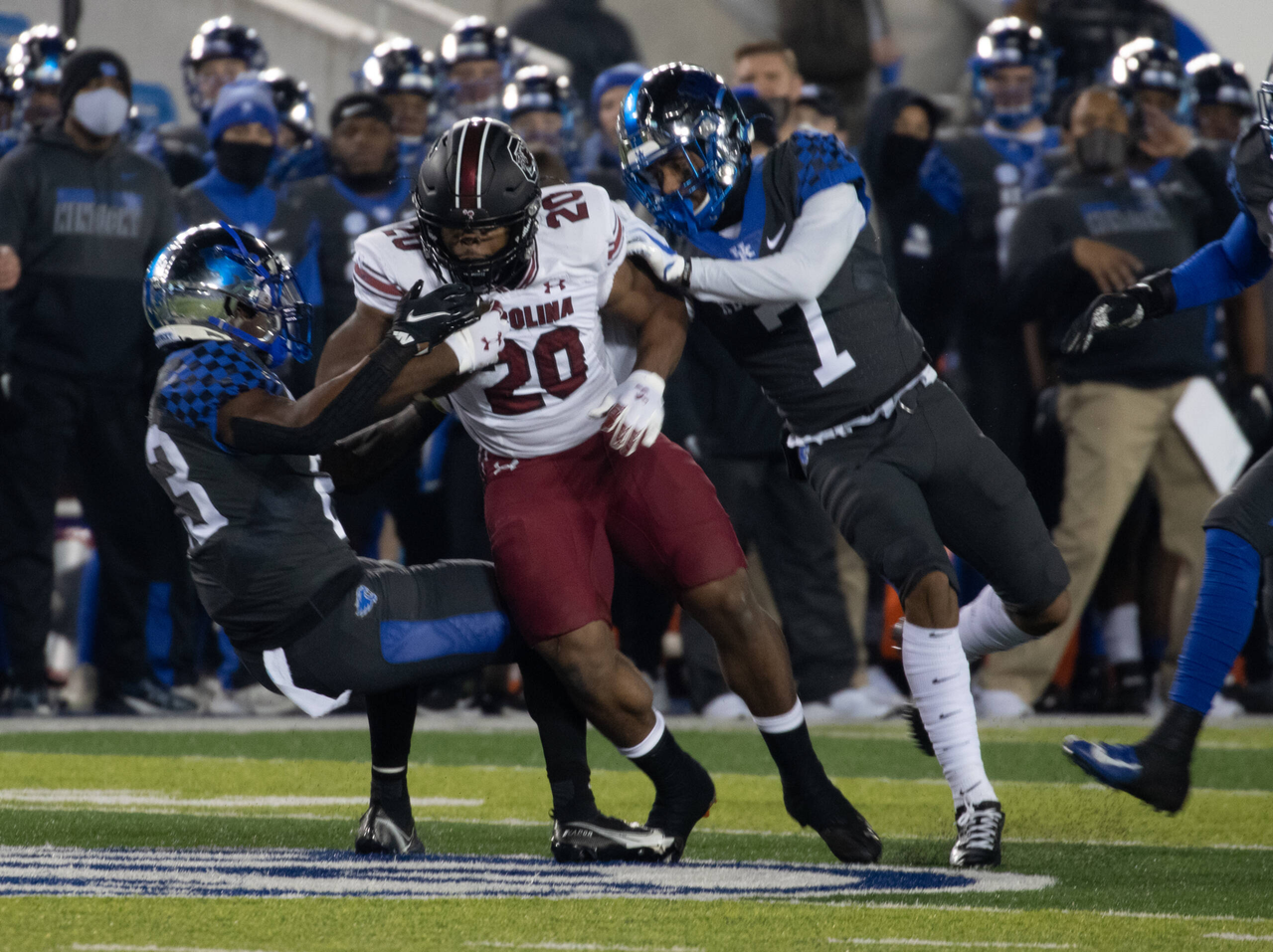 South Carolina Gamecocks running back Kevin Harris (20) Brought down by Kentucky Wildcats defensive back Tyrell Ajian (23) and safety Vito Tisdale (7) as Kentucky played South Carolina  on December 5, 2020.  Photo by Mark Cornelison 
